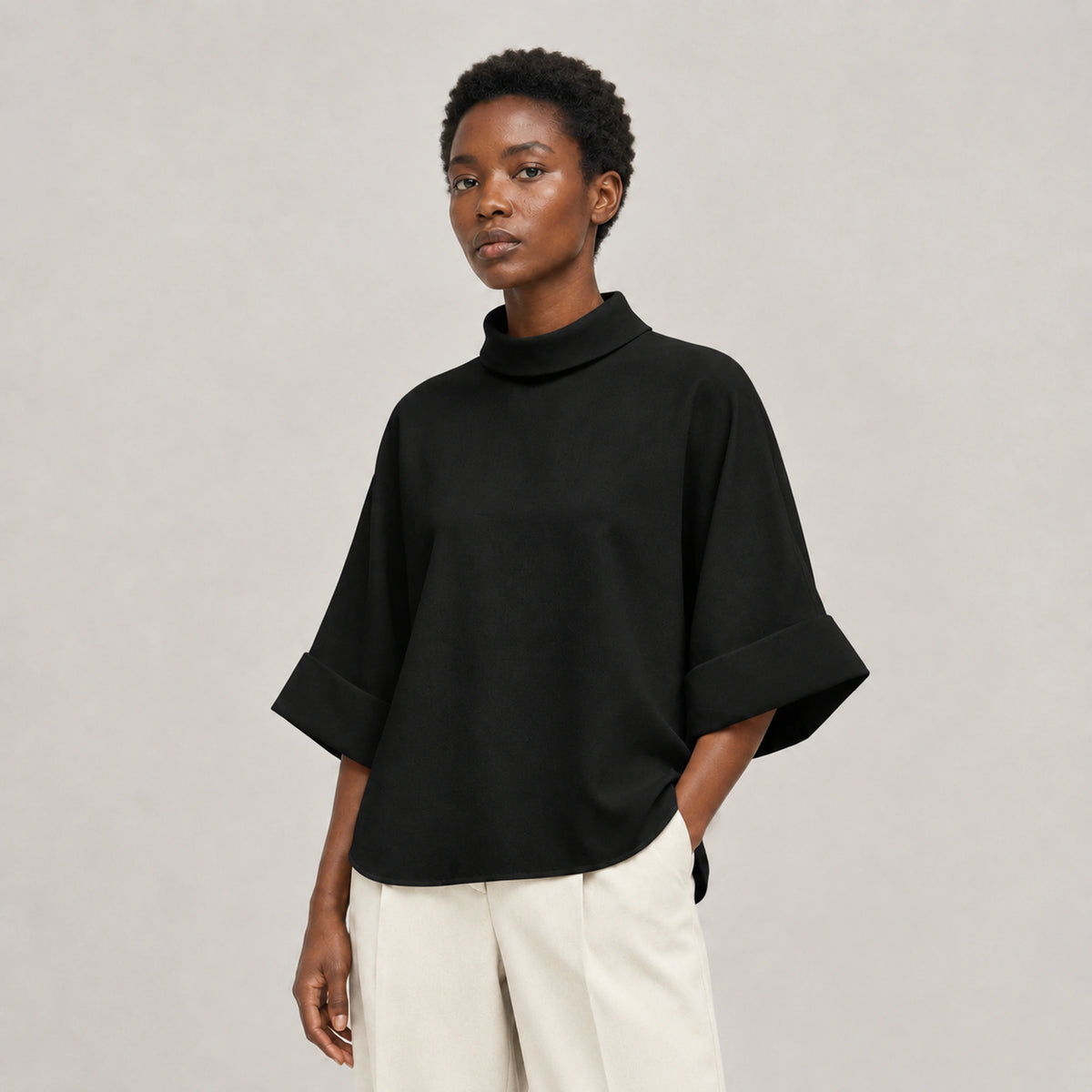 Aster Fold Blouse in Black, three-quarter studio view
