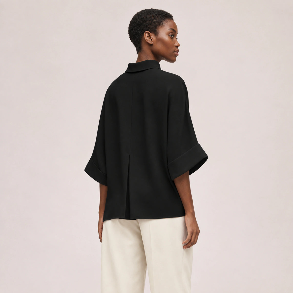 Aster Fold Blouse in Black, rear three-quarter view