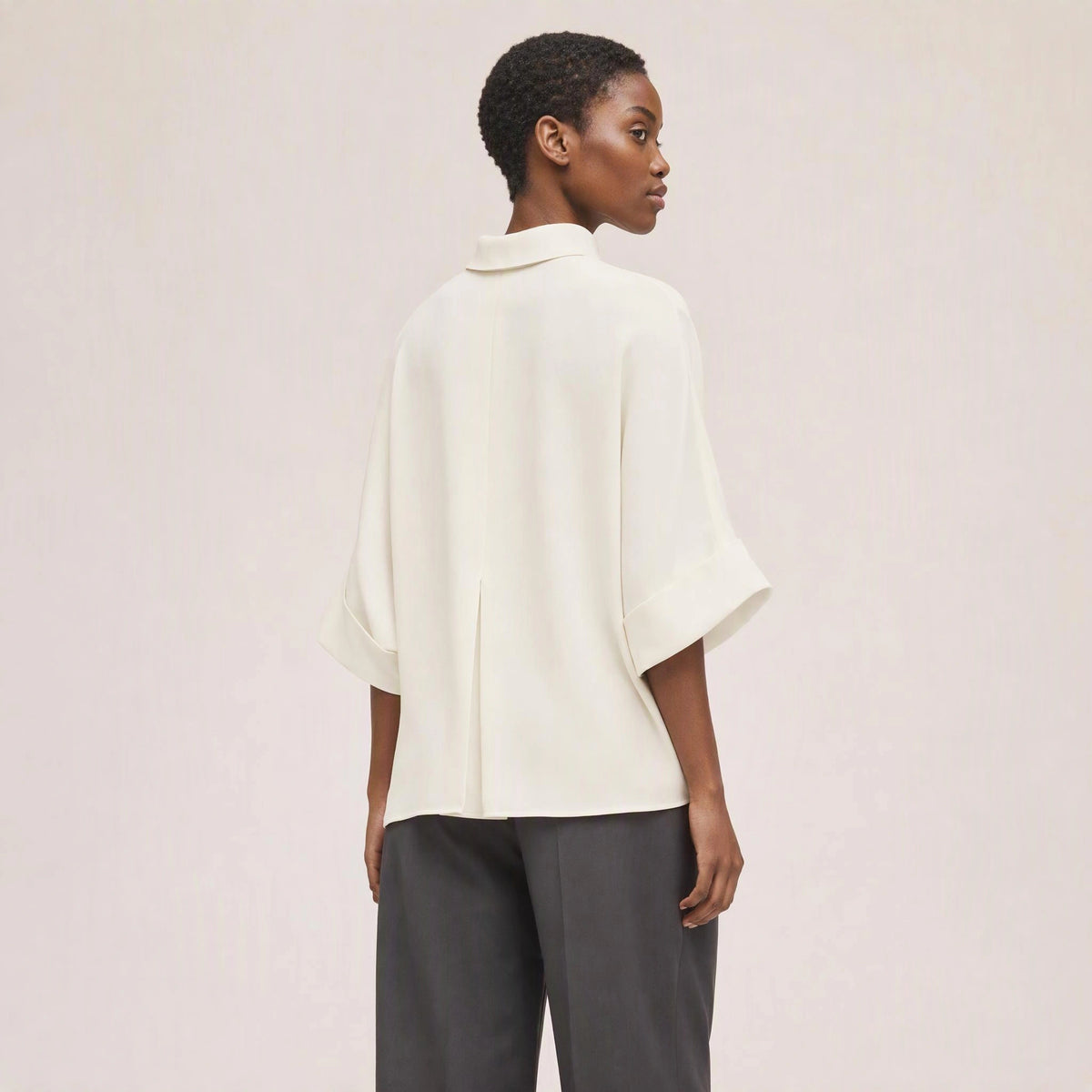 Aster Fold Blouse in Soft Ivory, rear three-quarter view